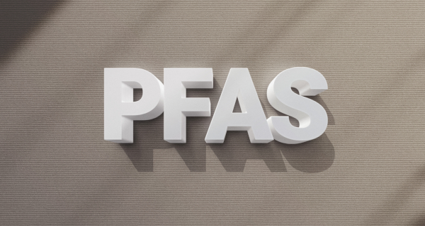 Decorative image for PFAS that says PFAS in white text on a brown background